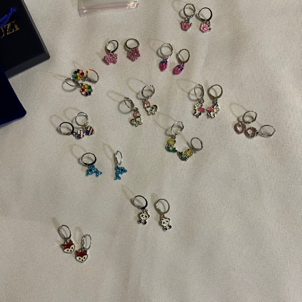 12 pairs earrings for little girls.  See dimes for size reference.  NEW